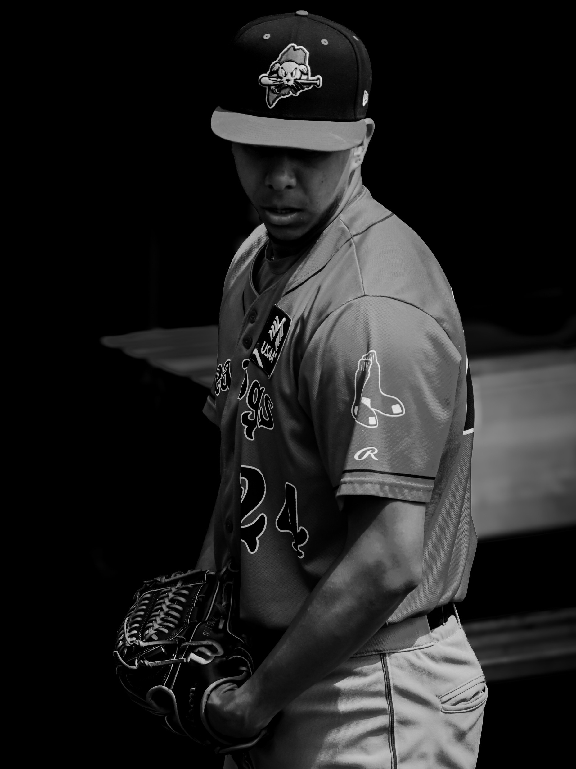 Black-and-white portrait of a Portland Sea Dogs pitcher on the mound