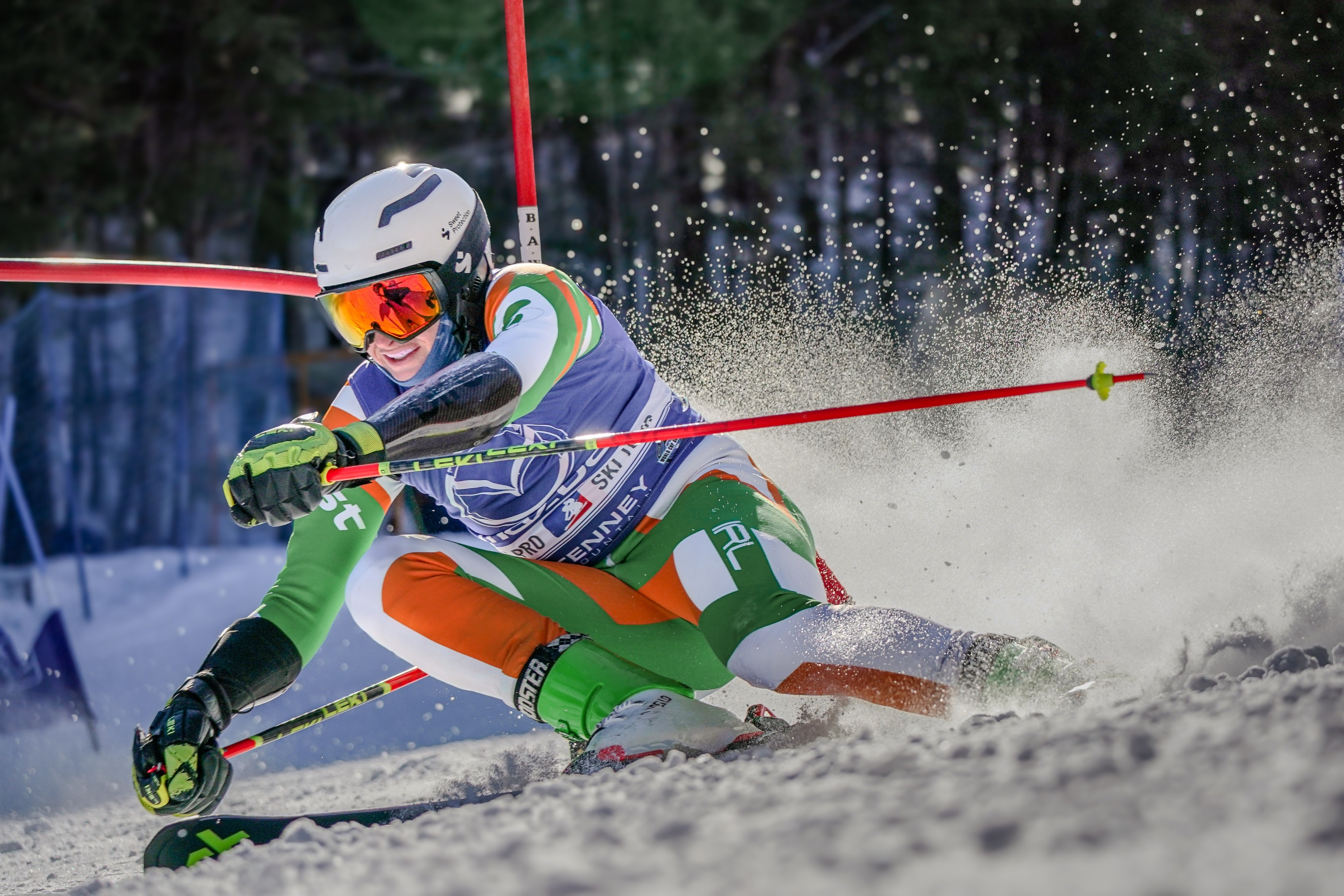 World Pro Ski Tour racer carving through a spray of snow